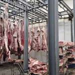 Half and full cows hanging | Beverly Creek